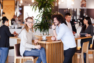 People at a cafe bar. Having fun. Conversations. Meetings. Casual and formal clothings.