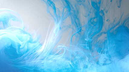 Blue and white cloud of ink on a white background. Drops of blue ink in water. Environmental...