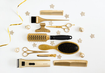 Golden hairdressing tools in the shape of a Christmas tree. Scissors, comb, brush, clip, hair salon...