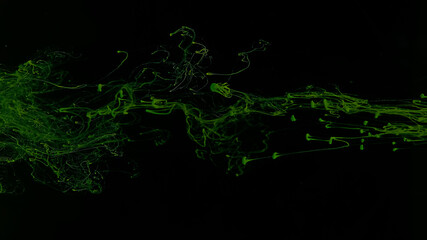 Awesome abstract background. Drops of green ink in water. Cosmic star background. Green watercolor paints in water on a black background. Beautiful wallpaper for your desktop.