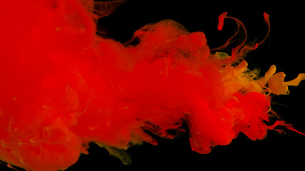 Awesome abstract background. Orange ink droplets in water. Cosmic star background. Orange watercolor paints in water on a black background. Beautiful wallpaper for your desktop.