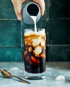 Cold-brew iced coffee with cream swirl pour