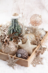 Fototapeta na wymiar Golden christmas balls with wool background.