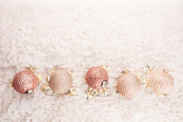 Golden christmas balls with wool background.