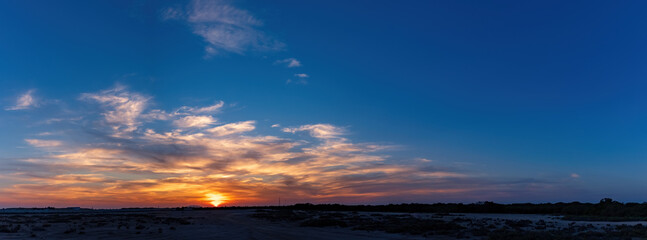 Panoramic sunset with golden cloudscape. Al Khor, Qatar