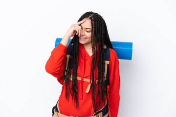 Hiker teenager girl with braids over isolated white background laughing