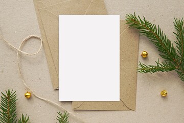 Christmas greeting card mockup, blank vertical notecard, postcard, craft paper envelopes, fir tree...