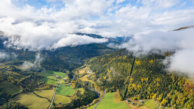 Autumn clouds above Norwegian contryside © Jakub