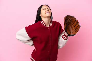 Teenager player with baseball glove isolated on pink background suffering from backache for having made an effort