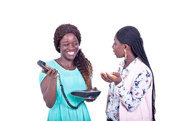 two beautiful young women chatting together smiling.