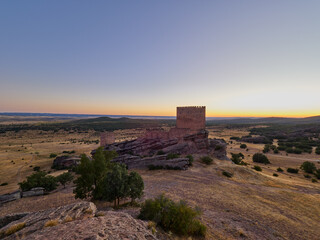 Fototapeta premium View of the castle of Zafra at sunset, Spain