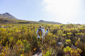 Family hiking a nature trail, Phillipskop nature reserve, Stanford, South Africa.