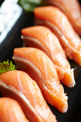 Raw salmon sushi on a plate