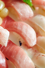 Various tuna sushi on a plate