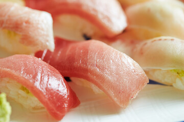 Various tuna sushi on a plate