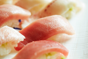 Various tuna sushi on a plate