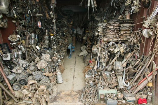 An Auto Parts store. A small workshop heaped up with spare car parts