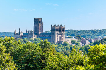 Fototapeta na wymiar A view across the treetops towards the Cathedral in Durham, UK in summertime