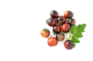 Black cherry tomatoes on a white background. Indigo tomatoes isolated.