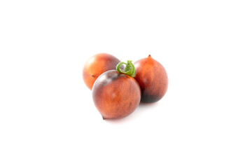 Fototapeta na wymiar Black cherry tomatoes on a white background. Indigo tomatoes isolated.