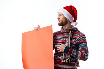 Cheerful man in New Year's clothes holding a banner holiday copy-space studio