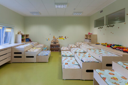 Modern day care nursery or pre-school kindergarten school, bedrooms for nap time, pull out bunks
