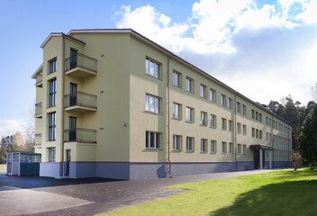 Modern youth hostel building, accommodation for travellers, building exterior.