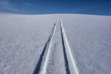 Sled tracks on snow.