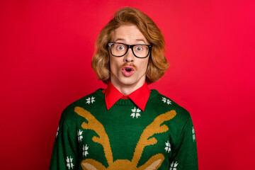 Portrait of attractive funky amazed guy news reaction eve day time isolated over bright red color...