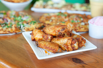 A plate of chicken wings at a party
