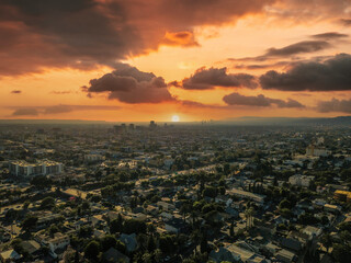 a gorgeous aerial shot of the cityscape of the city of Los Angeles with powerful clouds in the sky