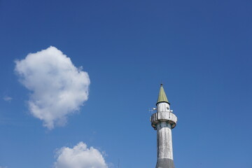 white wooden mosque minaret