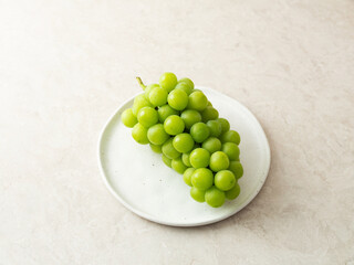 Shine Muscat, green grapes on a plate 