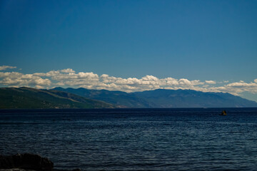 mountain coast, clouds over the mountains, the evening sea, the Adriatic Sea 