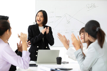 Fototapeta premium young businesswoman seminar or meeting and clapping hands together with work team for successful at a job