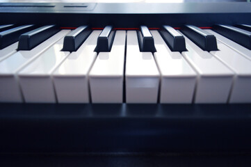 Digital Piano Keyboard - Photo of a musical instrument, closeup with white and black keys