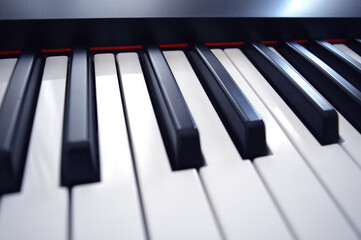 Digital Piano Keyboard - Photo of a musical instrument, closeup with white and black keys