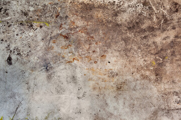 Background image of a grunge texture in gray-brown tones. Abstract background with stains of rust, dirt and paint.