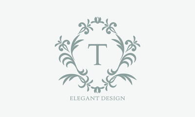 Obraz premium Exquisite design of an elegant monogram with the letter T in the center in gray. Logo for boutiques, cafes, bars, restaurants, invitations. Business style and brand of the company