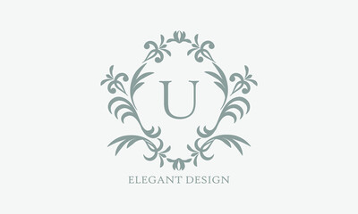 Exquisite design of an elegant monogram with the letter U in the center in gray. Logo for boutiques, cafes, bars, restaurants, invitations. Business style and brand of the company