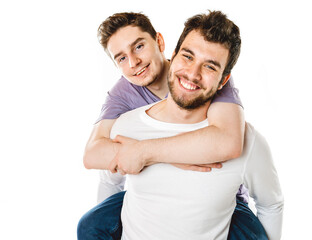 Young gay couple standing together over isolated background