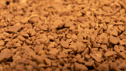 a pile of instant coffee granules background texture.