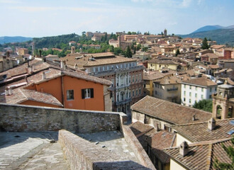 Fototapeta na wymiar View of the rooftops in the historic center of Perugia. Mountains in the background. Umbria. Italy. Europe 