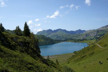Naklejka na ściany i meble Engstlensee in Switzerland. Natural lake used for production of electricity. High altitude lake in Alps mountains.