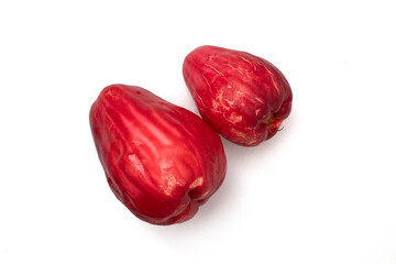 red guava fruit on a white background