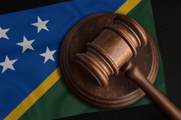 Judge Gavel and flag of Solomon Islands. Law and justice in Solomon Islands. Violation of rights...