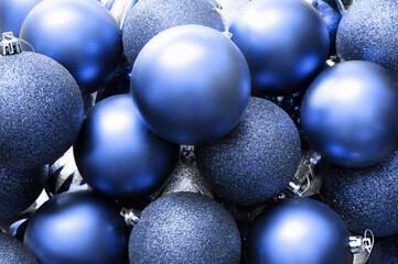 Glitter Christmas balls blue background. Holiday decoration.