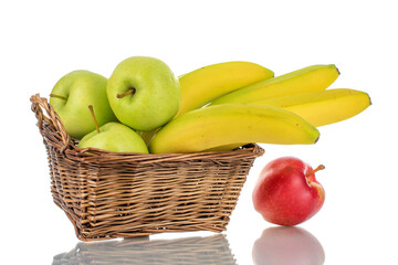 Several juicy apples and bananas in a basket, close-up, isolated on white.