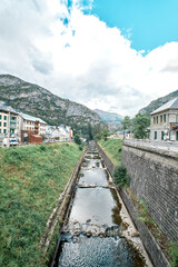 Fototapeta na wymiar Canfranc, Spain - September 8, 2021: river passing by the railway station