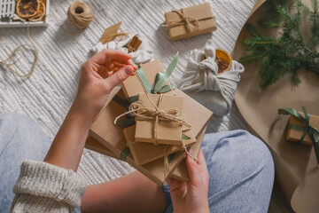 Christmas gift zero waste, eco friendly hand made box packaging gifts in kraft paper wooden table, eco christmas holiday concept, Christmas gift wrapping,eco decor banner